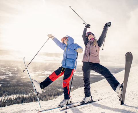 people holding snowboards